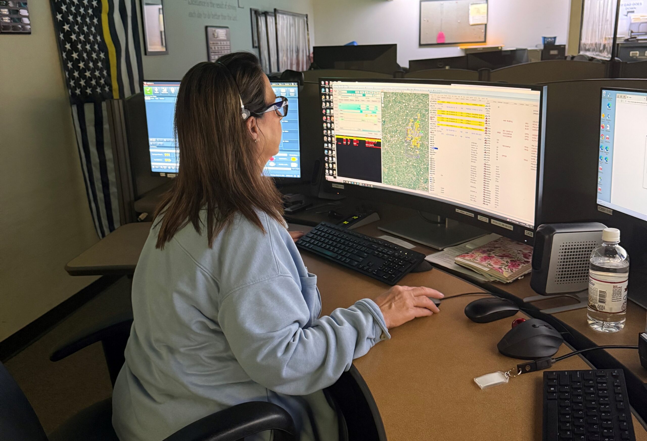 911 operator working at computer